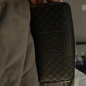 Gucci wallet some tears on the side from normal wear and tear